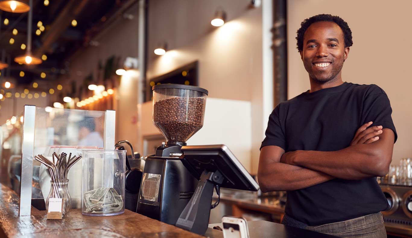 Portait shot young coffee shop owner